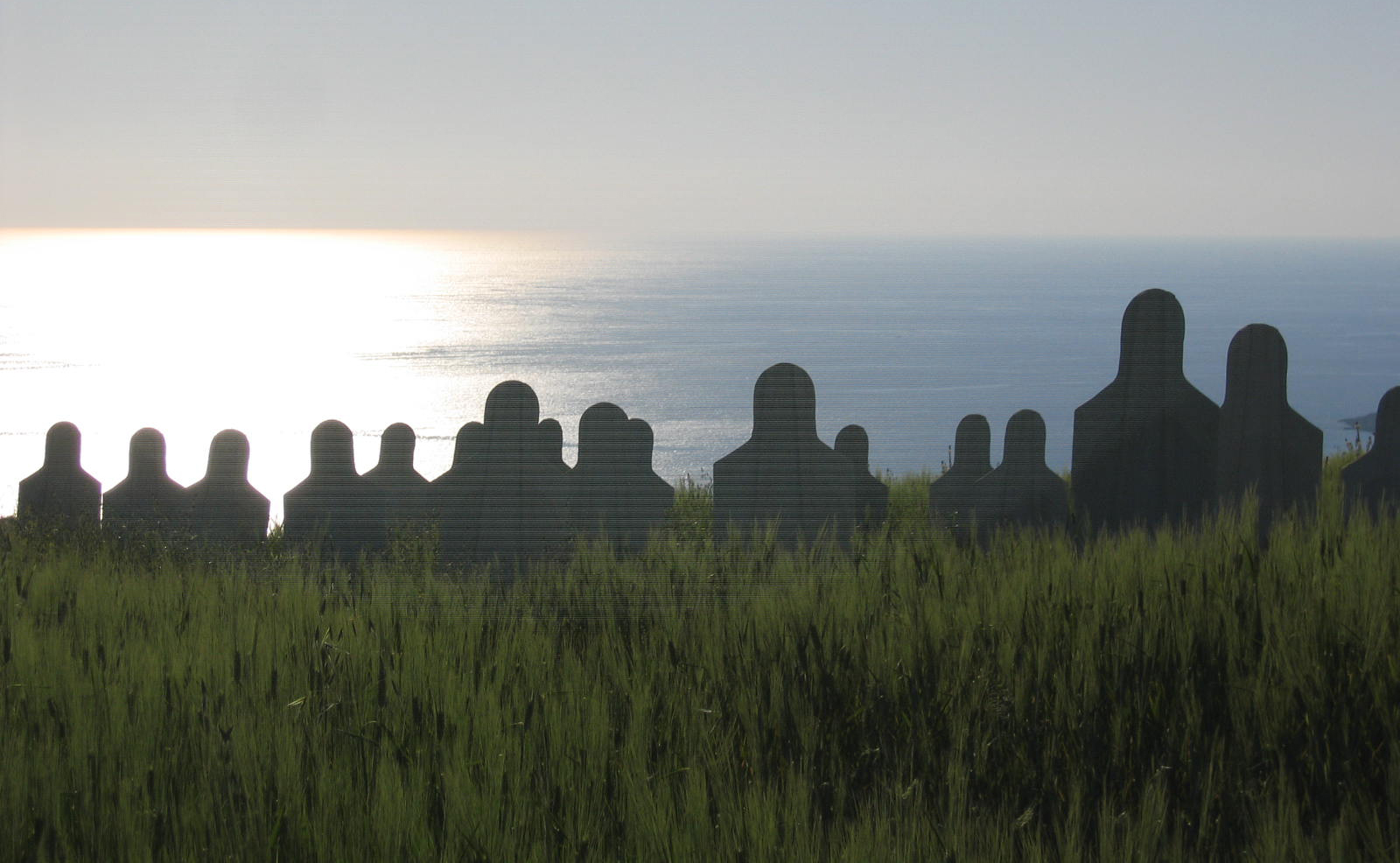 Silhouettes of Human Targets looking at the sea