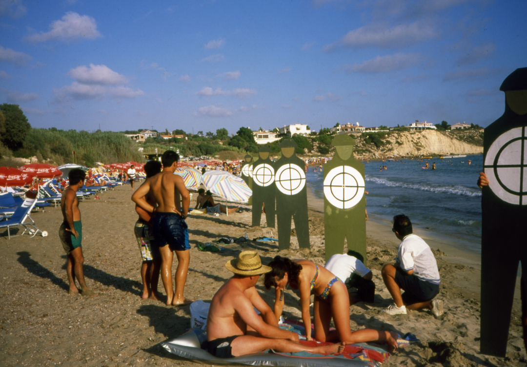 Soldier Targets in a beach among swimmers