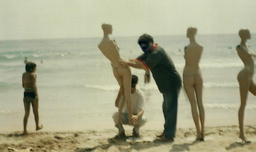 The artist installing Mannequins at the beach