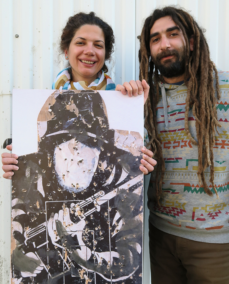 A couple holding a target