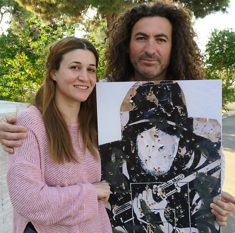 A couple holding a target